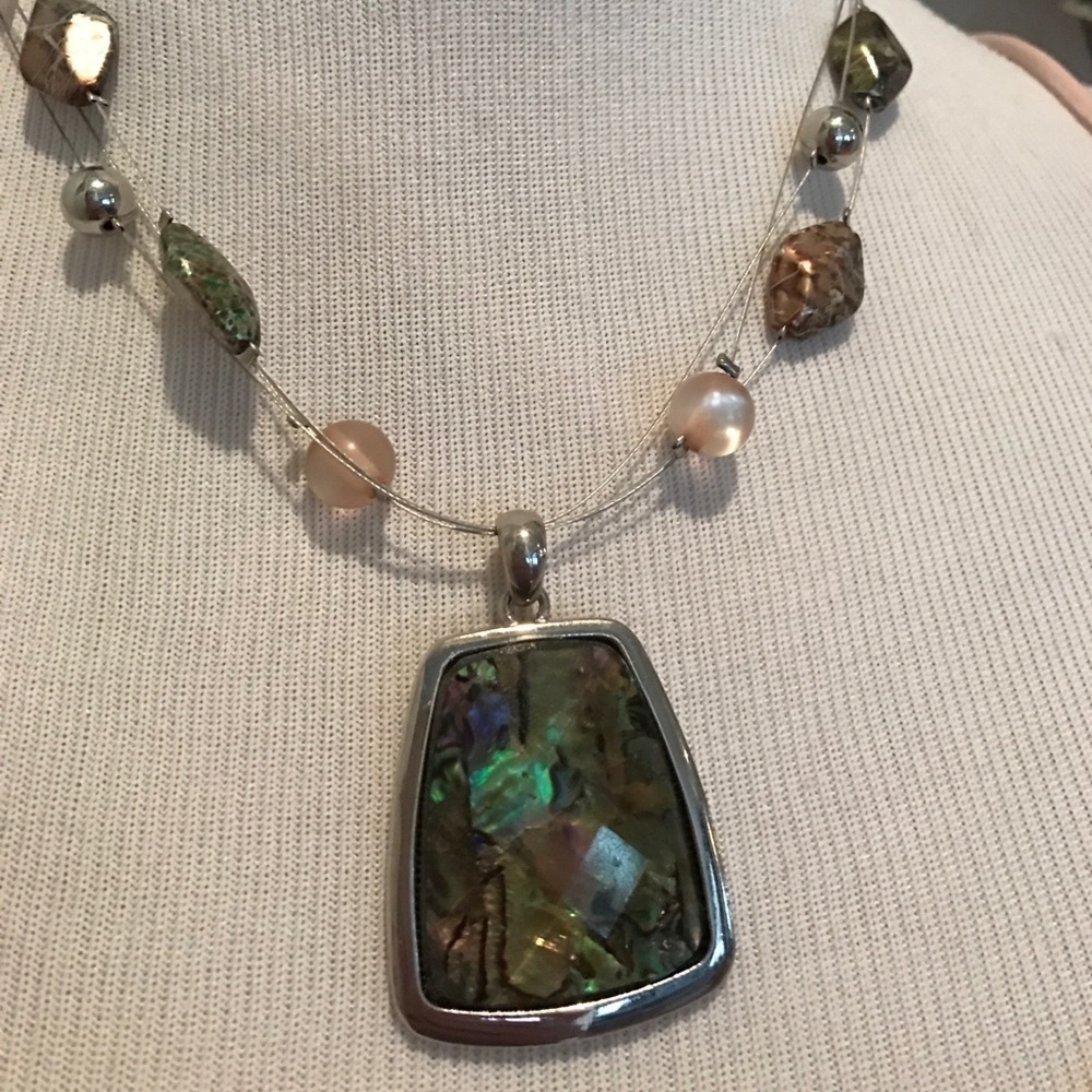 Faceted colorful pendant on triple wire with beads